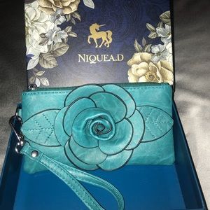 Teal NIQUEA.D wristlet